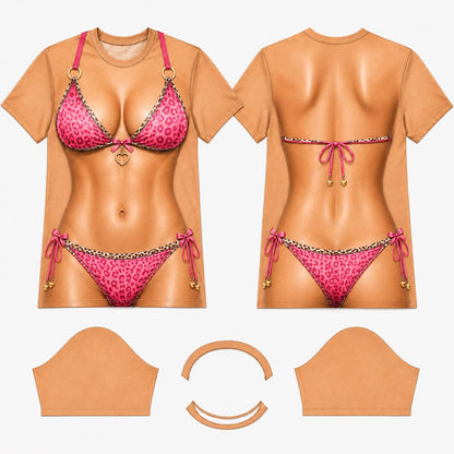 May include: A tan t-shirt featuring a realistic graphic print of a torso wearing a pink leopard print bikini. The front displays a bikini top with a gold heart charm and a bottom with side ties. The back shows the bikini straps and ties.
