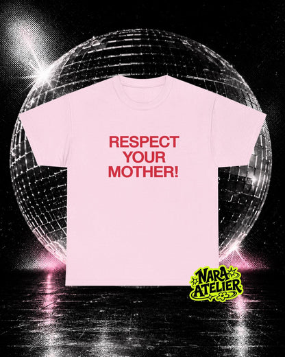 May include: A light pink short-sleeved t-shirt featuring the text "RESPECT YOUR MOTHER!" printed in bold red capital letters across the chest. The shirt has a crew neckline and a standard fit, presented as a flat garment display.