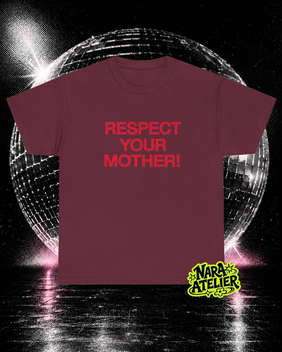 May include: A maroon short-sleeved t-shirt featuring the text "RESPECT YOUR MOTHER!" printed in red on the chest. The shirt is displayed against a dark background with a large, reflective disco ball and a small yellow "NARA ATELIER" logo.