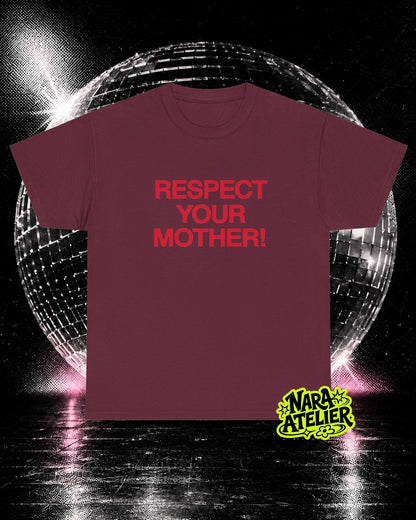May include: A maroon short-sleeved t-shirt featuring the text "RESPECT YOUR MOTHER!" printed in red on the chest. The shirt is displayed against a dark background with a large, reflective disco ball and a small yellow "NARA ATELIER" logo.