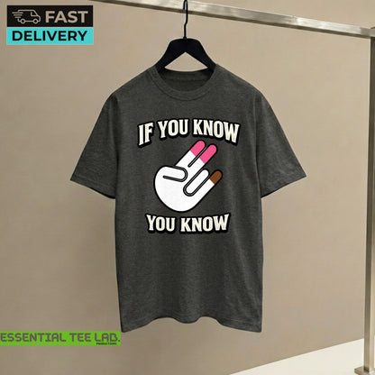 May include: A dark gray short-sleeve t-shirt featuring a graphic of a white hand making a two-finger gesture with pink and brown tips. The text "IF YOU KNOW" is printed in white above the hand, and "YOU KNOW" is printed in white below the hand.