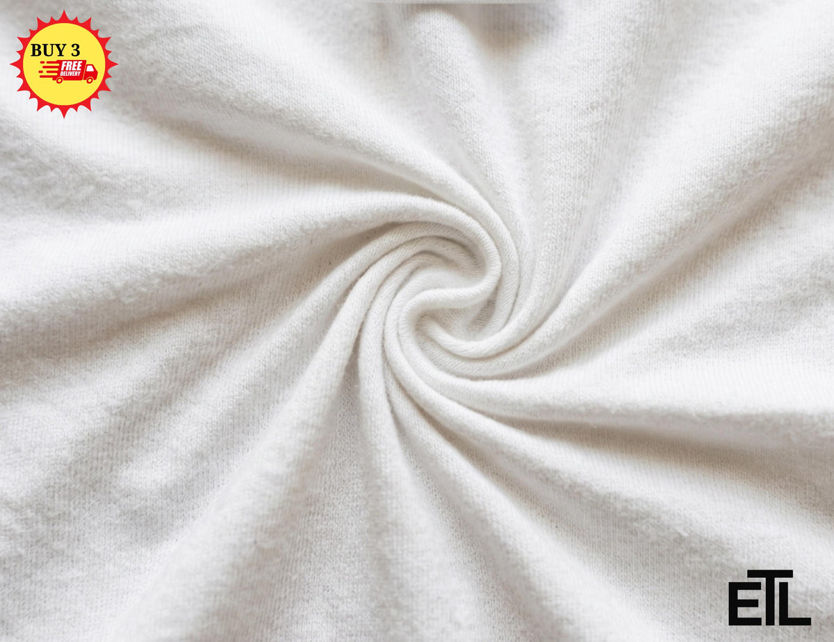 May include: A plain white fabric with a soft, textured surface arranged in a central spiral swirl pattern. The material features a consistent matte finish and dense weave, creating subtle shadows within the folds of the fabric's circular design.