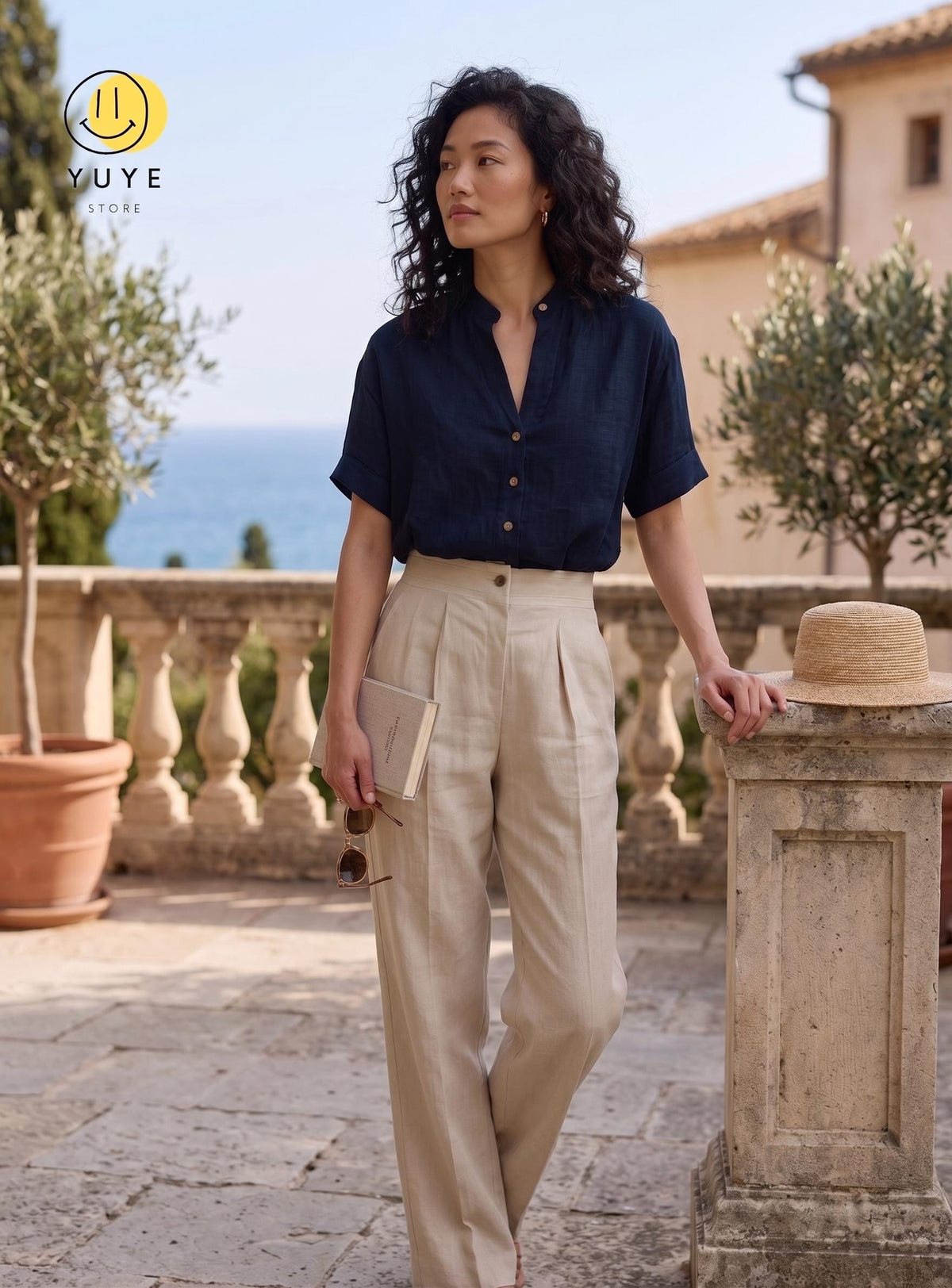 May include: A dark navy blue short-sleeved button-down shirt with a mandarin collar paired with high-waisted beige trousers featuring front pleats. The shirt has a visible button placket and cuffed sleeves. The outfit is clean and structured.