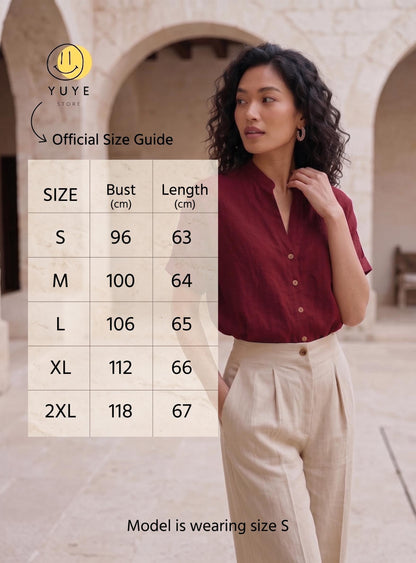 May include: A dark red short-sleeved button-down shirt with a mandarin collar paired with beige high-waisted trousers. An overlay displays the YUYE STORE Official Size Guide with bust and length measurements in cm for sizes S through 2XL.