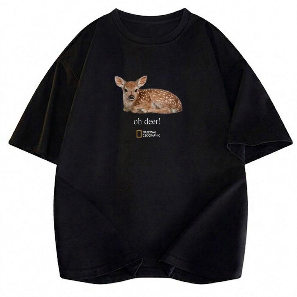 May include: A black short-sleeved t-shirt featuring a realistic graphic of a spotted fawn lying down. Below the fawn, the text reads "oh deer!" in a white serif font, followed by the National Geographic logo with its signature yellow rectangle.