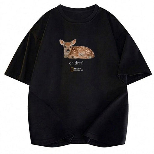 May include: A black short-sleeved t-shirt featuring a realistic graphic of a spotted fawn lying down. Below the fawn, the text reads "oh deer!" in a white serif font, followed by the National Geographic logo with its signature yellow rectangle.
