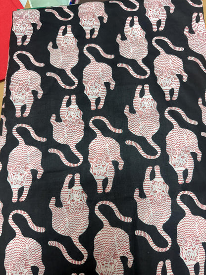 May include: A black fabric featuring a repeating pattern of stylized tigers. Each tiger is rendered in a white and red wavy line design, showing the animals in various positions across the surface of the textile material.