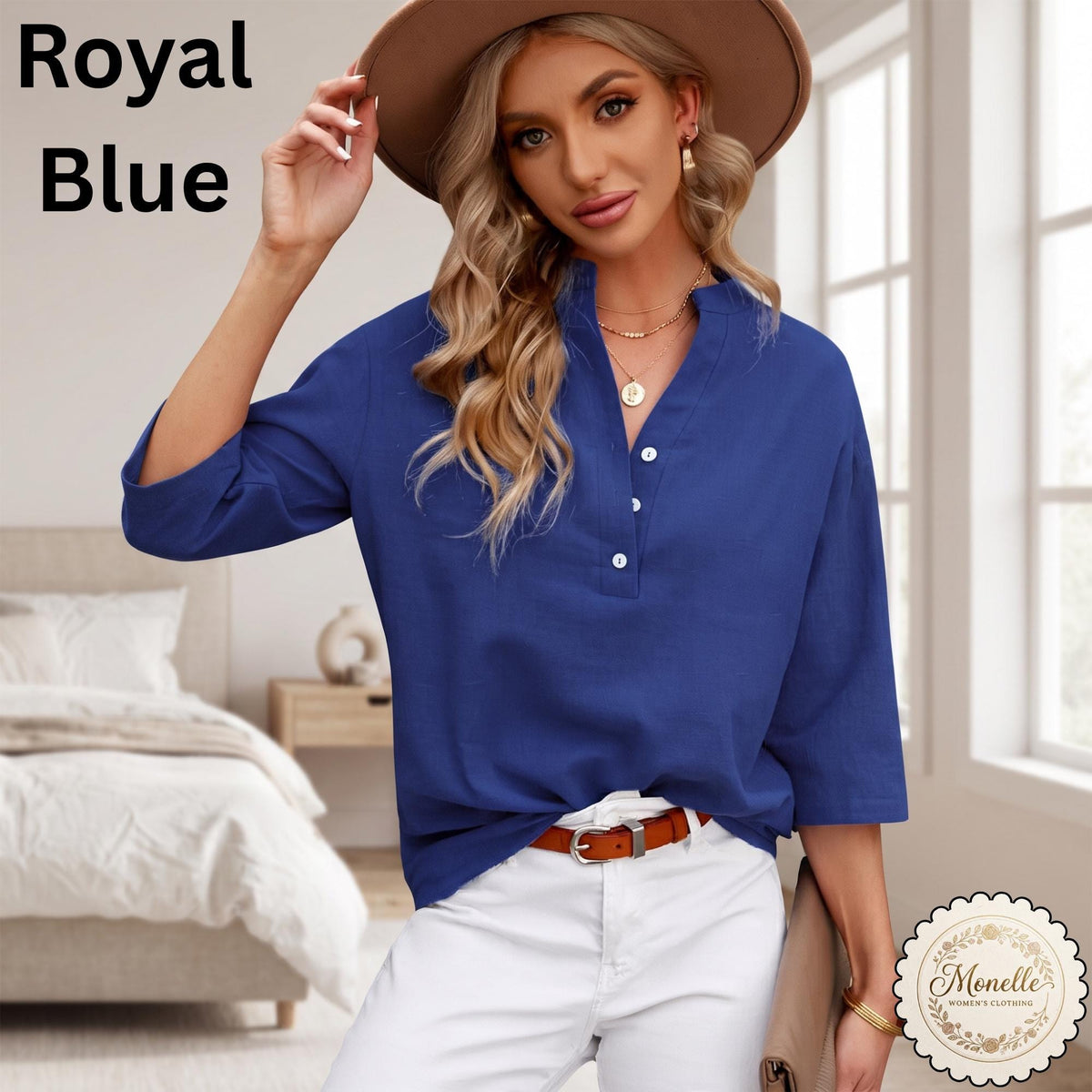May include: A royal blue long-sleeve shirt featuring a V-neckline with a partial button placket, three white buttons, and a relaxed fit. The text Royal Blue is visible in the upper left corner, and a Monelle logo is in the bottom right corner.