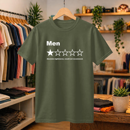 May include: An olive green short-sleeved t-shirt featuring the white text 'Men' above a single filled star and four empty stars, followed by the text 'Absolute nightmares, would not recommend.' The shirt has a crew neckline and a standard fit.