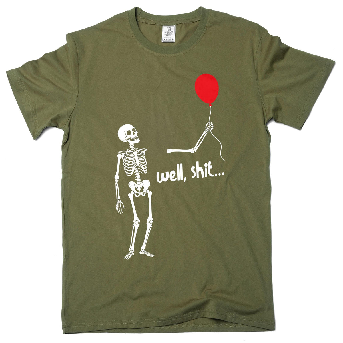 May include: An olive green short-sleeved t-shirt featuring a white graphic of a skeleton looking up at a detached arm holding a red balloon. The text "well, shit..." is printed in white below the arm. The shirt has a crew neckline and a tag.