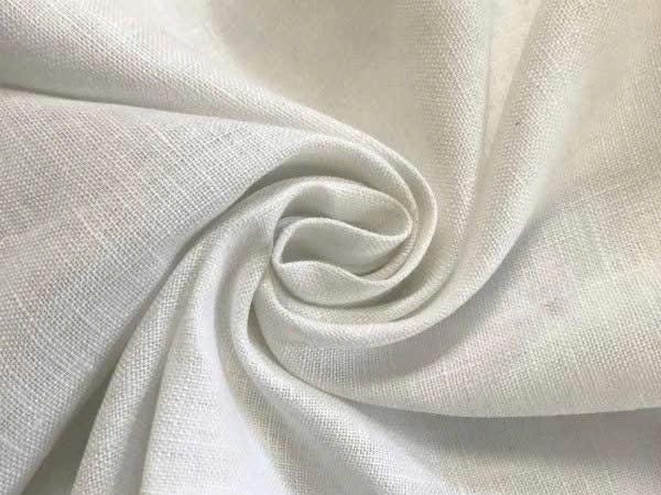 May include: A piece of white fabric with a visible woven texture, arranged in a swirling, gathered pattern that creates soft folds and shadows. The material displays a natural, slightly irregular weave characteristic of linen or a similar textile.