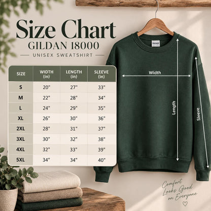 May include: A dark green Gildan 18000 unisex sweatshirt hanging on a wooden hanger. A size chart displays width, length, and sleeve measurements in inches for sizes S through 5XL. White arrows indicate the measurement points on the sweatshirt.