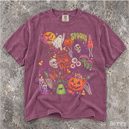 May include: A berry-colored short-sleeve t-shirt featuring a multi-colored graphic print of Halloween-themed illustrations including a ghost on a skateboard, a skull, a pumpkin, mushrooms, a UFO, and the text "SPOOKY" and "TRICK OR TREAT".