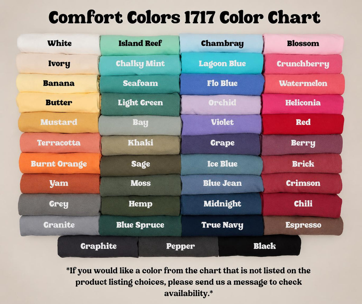 May include: A Comfort Colors 1717 color chart displaying a grid of folded t-shirts in various shades including white, ivory, banana, butter, mustard, terracotta, burnt orange, yam, grey, granite, island reef, chalky mint, seafoam, light green, bay, khaki, sage, moss, hemp, blue spruce, graphite, pepper, black, chambray, lagoon blue, flo blue, orchid, violet, grape, ice blue, blue jean, midnight, true navy, blossom, crunchberry, watermelon, heliconia, red, berry, brick, crimson, chili, and espresso.