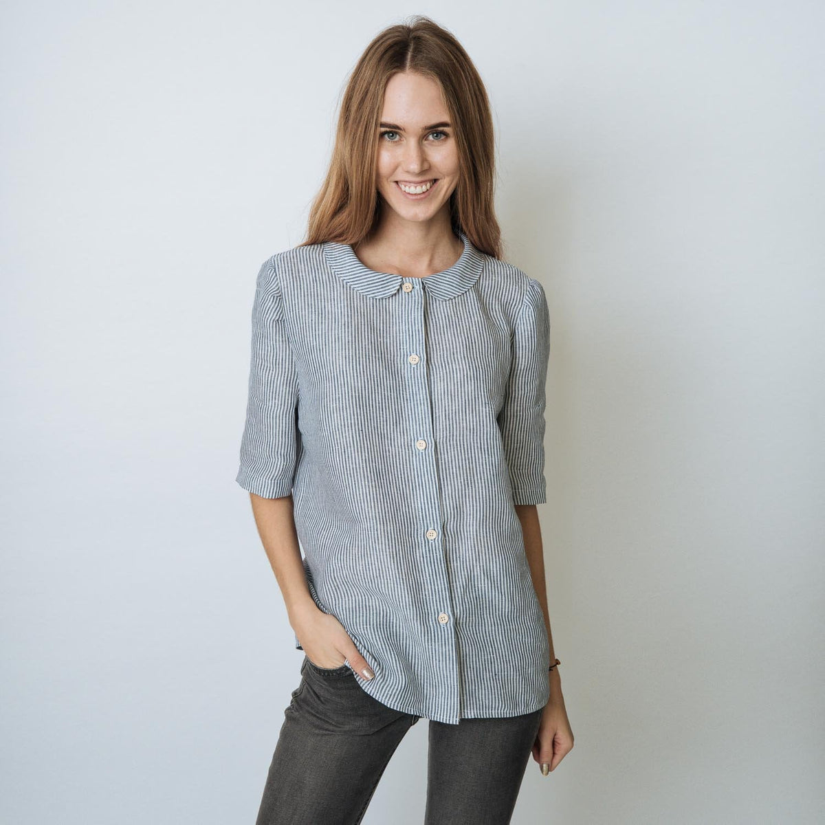 Elegant linen medium sleeve shirt sewn with natural colour wooden buttons. Beautiful linen shirt for your comfort and style. A shirt with a round collar.