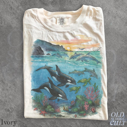 Ivory T-shirt with orcas, dolphins and sea turtles graphic
